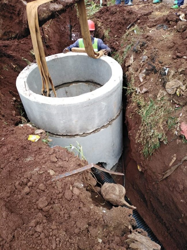 Secondary Sewer TS1.282.12 (ID200 DWC-HDPE)- Installation of precast concrete rings in progress